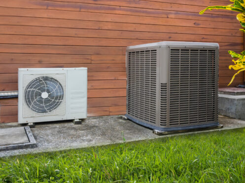 Air conditioner unit and heat pump outside a Dallas home