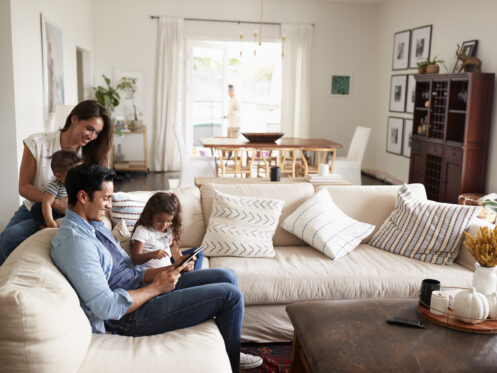 A young family reading together in their Dallas home