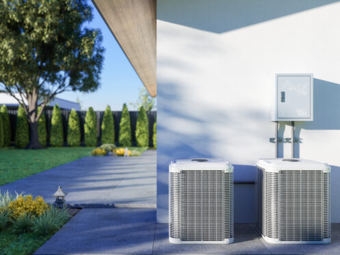 Two AC units in a backyard in Dallas, OR