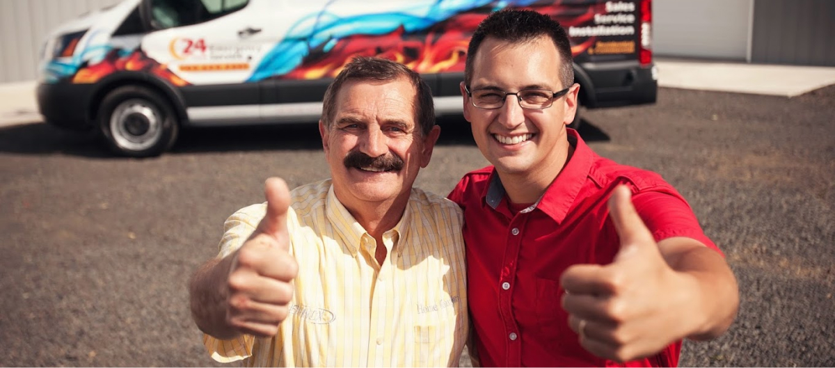 two men hugging with their thumps up